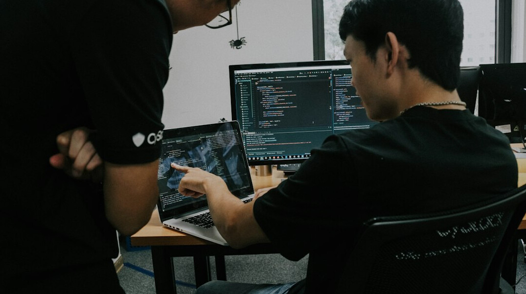 programmer coding at desk