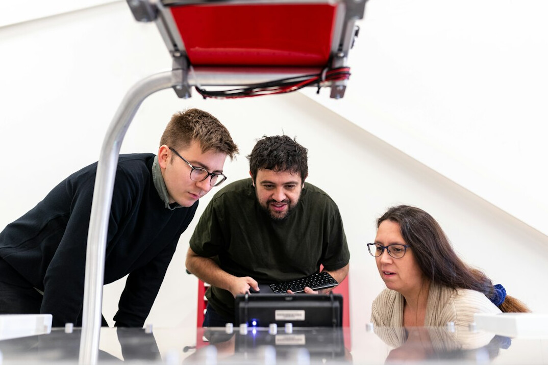 group of adults in coding workshop