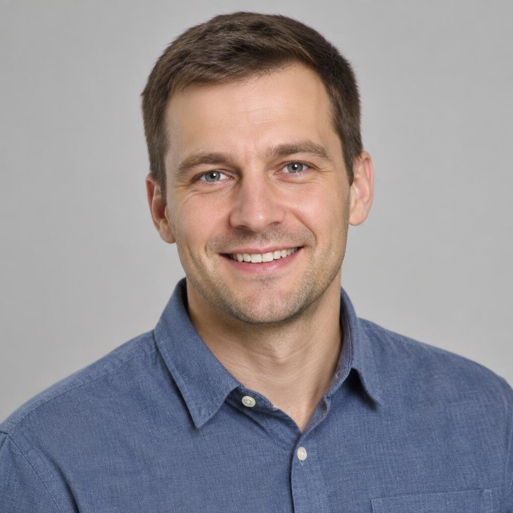 Portrait of a smiling man with short brown hair