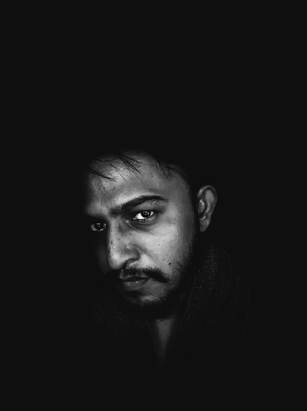 Portrait of a bearded man looking at camera